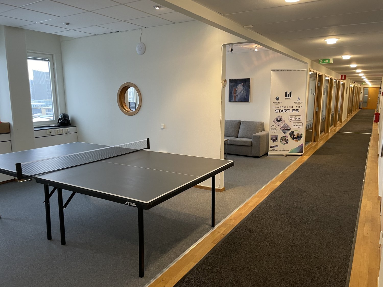 A pingpong table in an open office space