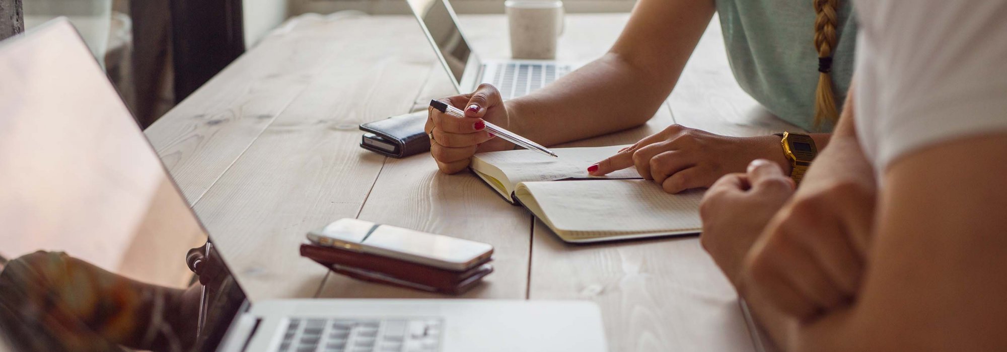 Two persons sitting and working together